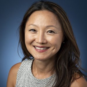 Headshot blue background